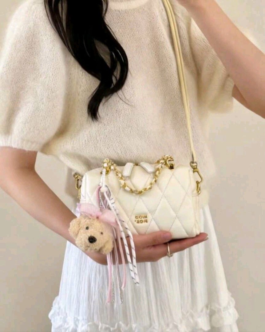 White Quilted Shoulder Bag with Teddy Bear Charm Chio '2nd (Category: Luxury Bags & Wallets) located in Quezon City. Submitted by twinkle97 (Listing ID 1440268321, Image 3). Description: - Adorable white quilted bag - Chic gold chain strap - Comes with a fluffy teddy bear charm (with pink bow!) - Versatile: wear as a shoulder bag or crossbody - Ideal for everyday errands or a stylish night out - Easily matches a variety of outfits - Double zipper