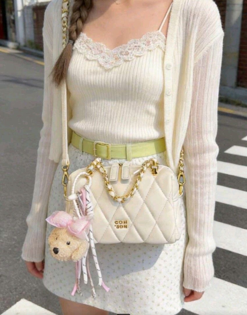 White Quilted Shoulder Bag with Teddy Bear Charm Chio '2nd (Category: Luxury Bags & Wallets) located in Quezon City. Submitted by twinkle97 (Listing ID 1440268321, Image 2). Description: - Adorable white quilted bag - Chic gold chain strap - Comes with a fluffy teddy bear charm (with pink bow!) - Versatile: wear as a shoulder bag or crossbody - Ideal for everyday errands or a stylish night out - Easily matches a variety of outfits - Double zipper