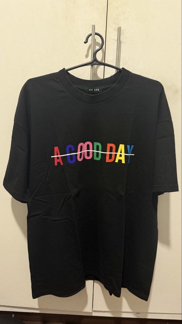 Wonwoo FLY ASG A GOOD DAY Graphic Tee (Category: Tshirts & Polo Shirts ) located in Mandaluyong City. Submitted by lhc96 (Listing ID 1440341017, Image 1). Description: - Brand: Authentic FLY ASG - Color: Black - Design: "A GOOD DAY" print - Fit: Oversized - Never used; purchased for 60,000 won - Note: 2nd and 3rd photos are not mine; used as reference only.