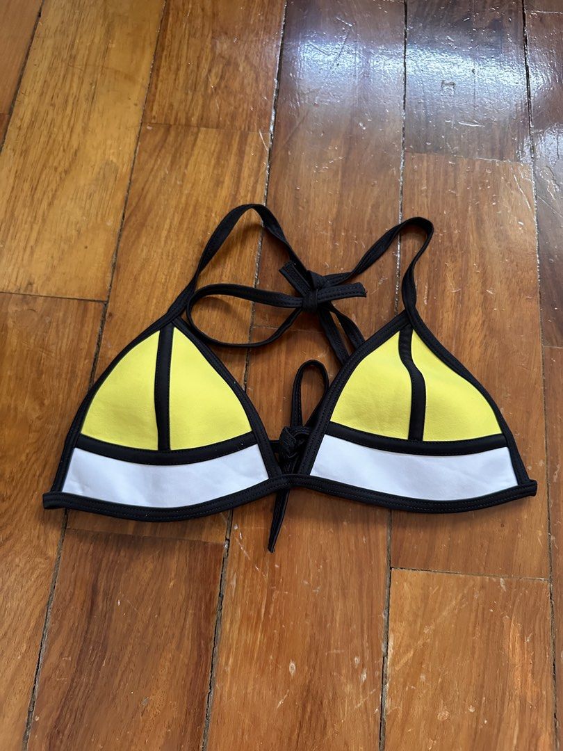 Yellow & White Triangle Bikini Top with Black Trim (Category: Bikinis & Swimsuits) located in Muntinlupa City. Submitted by prelovedbykram (Listing ID 1440352625, Image 1). Description: - Cute triangle bikini top - Bright yellow with white and black trim - Ties at neck and back for adjustable fit - Neoprene-like material - Ideal for beach, pool, or your next vacation!.