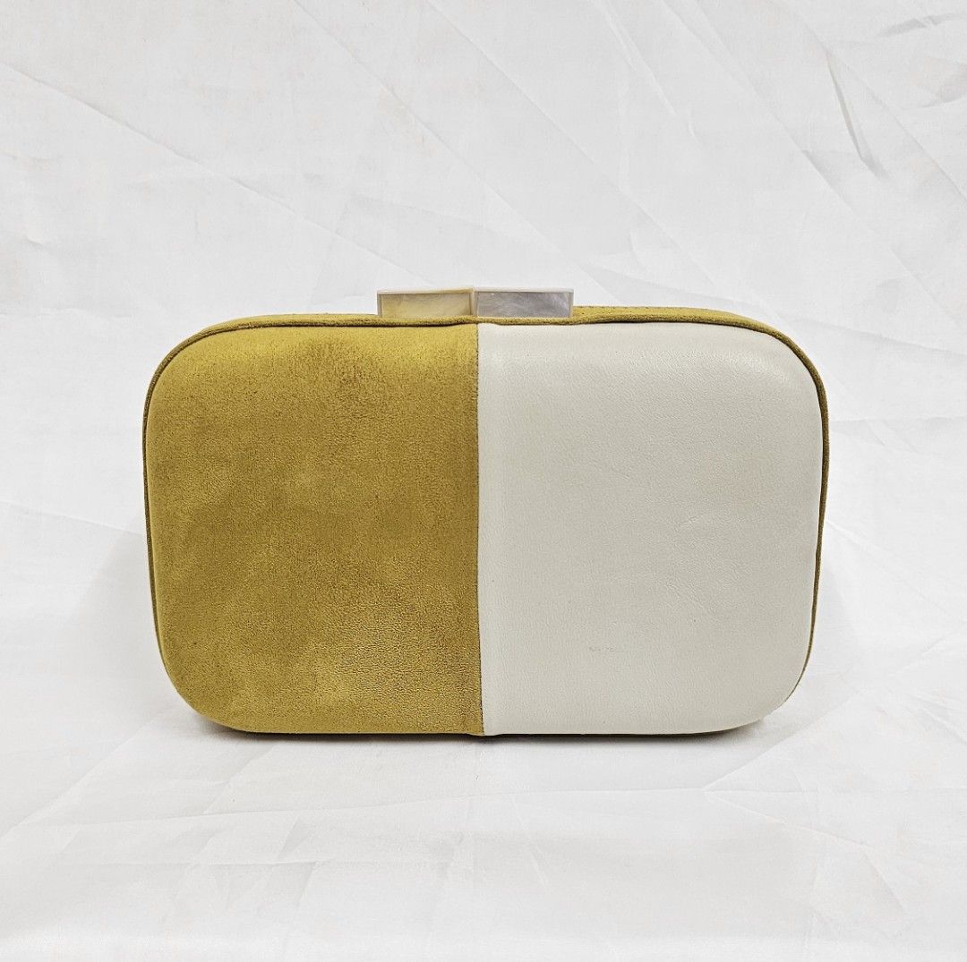 Yellow Suede and Leather Clutch Bag (Category: Clutches) located in Quezon City. Submitted by ilovenystuff (Listing ID 1440264144, Image 1). Description: Yellow suede and cream leather clutch. Has a unique colorblock design. The clasp closure has a mother-of-pearl detail. Great for evenings out or special occasions. Fits essentials like phone, cards, and lipstick. A stylish accessory to complete your look..