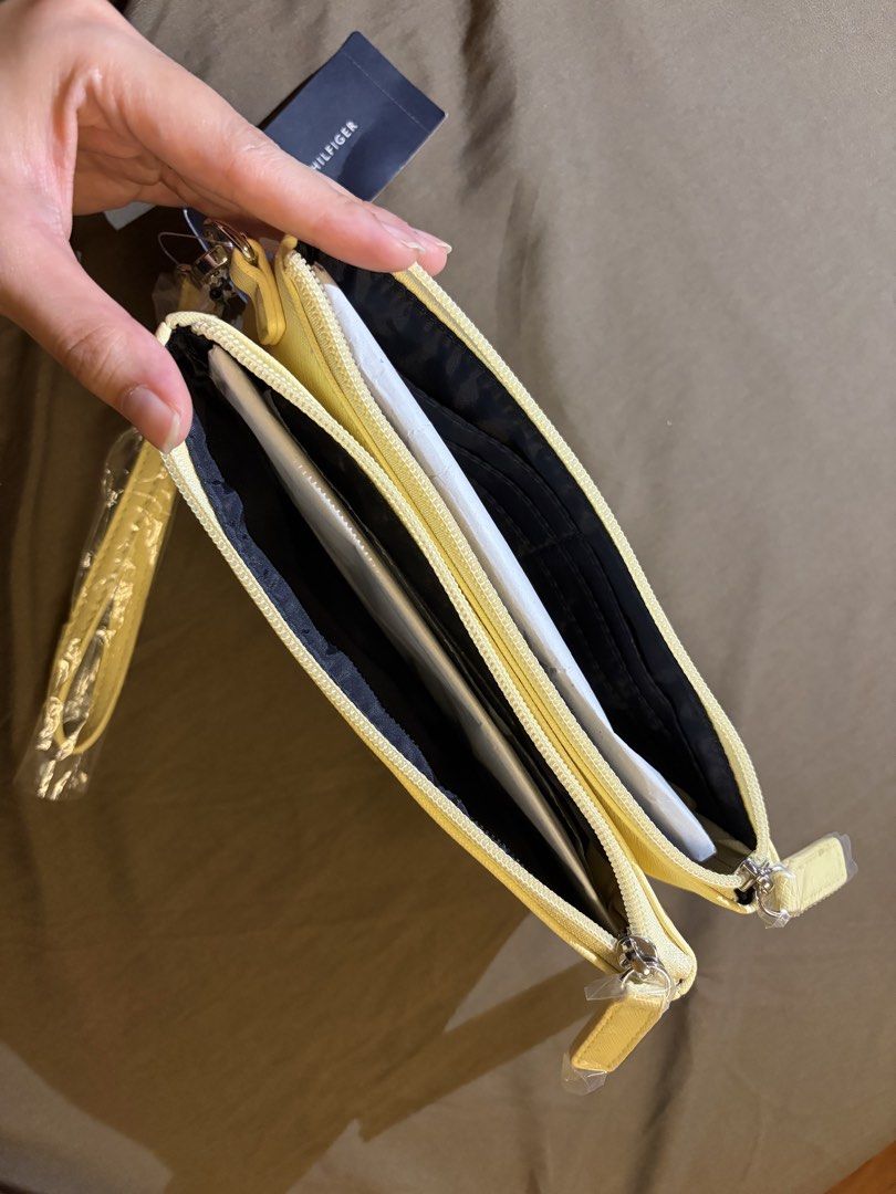 Yellow Tommy Hilfiger Wallet with tag (Category: Wallets & Card holders) located in Paranaque City. Submitted by czarinamatias (Listing ID 1440337738, Image 3). Description: Two-zipper pouch with card holders Price is negotiable.
