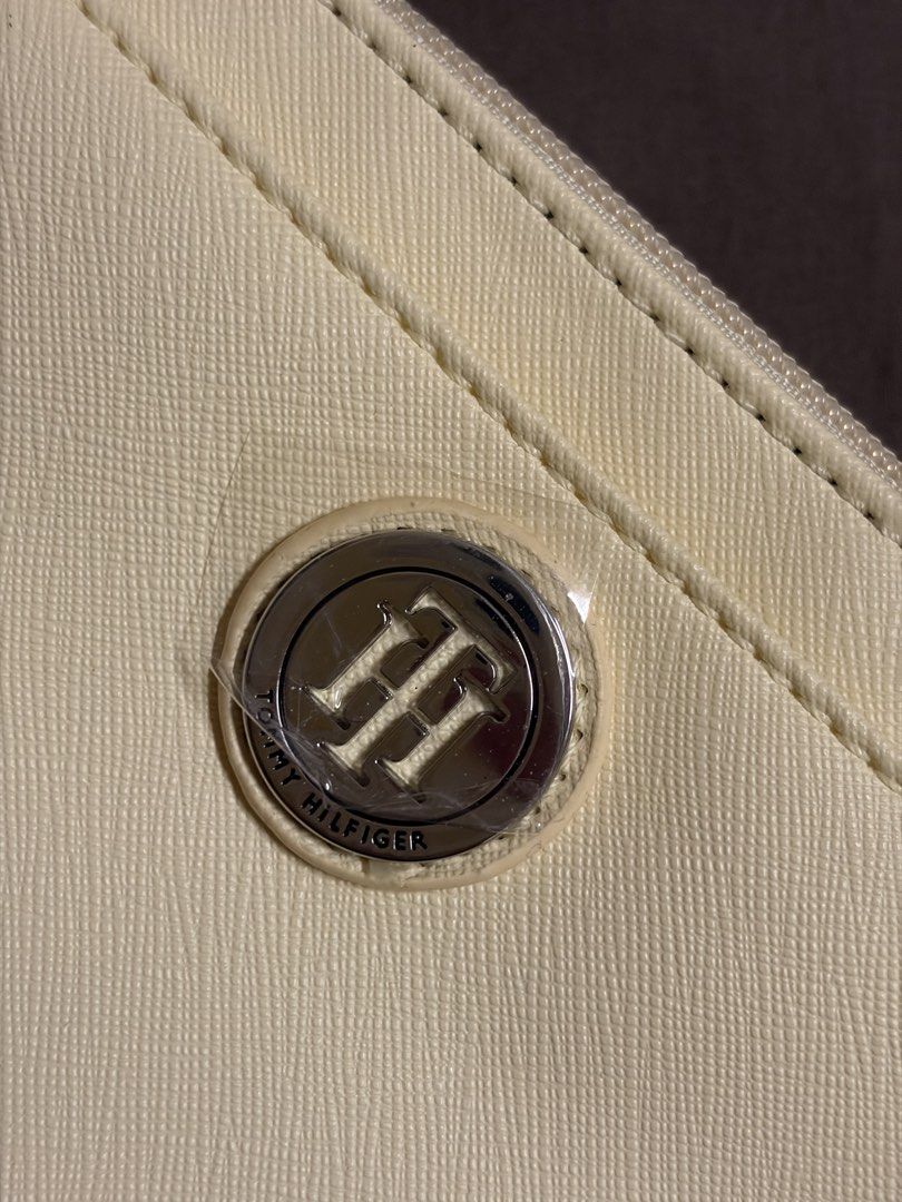 Yellow Tommy Hilfiger Wallet with tag (Category: Wallets & Card holders) located in Paranaque City. Submitted by czarinamatias (Listing ID 1440337738, Image 2). Description: Two-zipper pouch with card holders Price is negotiable.