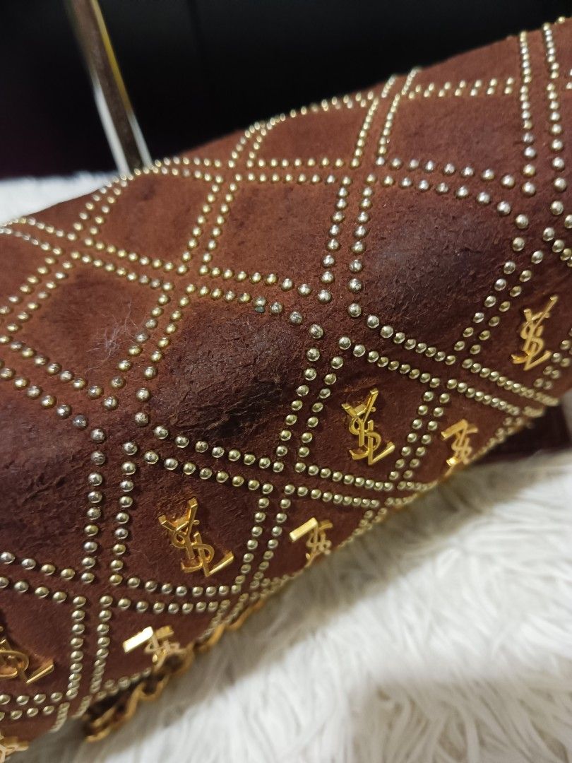 Yves Saint Laurent YSL Monogram Shoulder Bag (Category: Luxury Bags & Wallets) located in Digos. Submitted by chihanu (Listing ID 1440334840, Image 3). Description: - Brown suede shoulder bag - Features iconic gold YSL monograms - Adorned with gold stud details - Elegant diamond pattern throughout - Stylish gold chain strap - Ideal for evening events or as a statement piece.