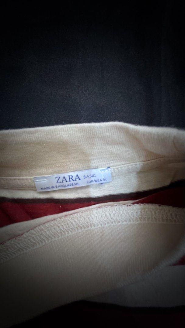 Zara Basic Striped T-shirt (Category: Shirts) located in Pasig City. Submitted by ___she___ (Listing ID 1440346627, Image 2). Description: - Zara maroon and white striped t-shirt - Short sleeves - Mock neck collar - Made in Bangladesh - Basic, versatile style for casual wear.