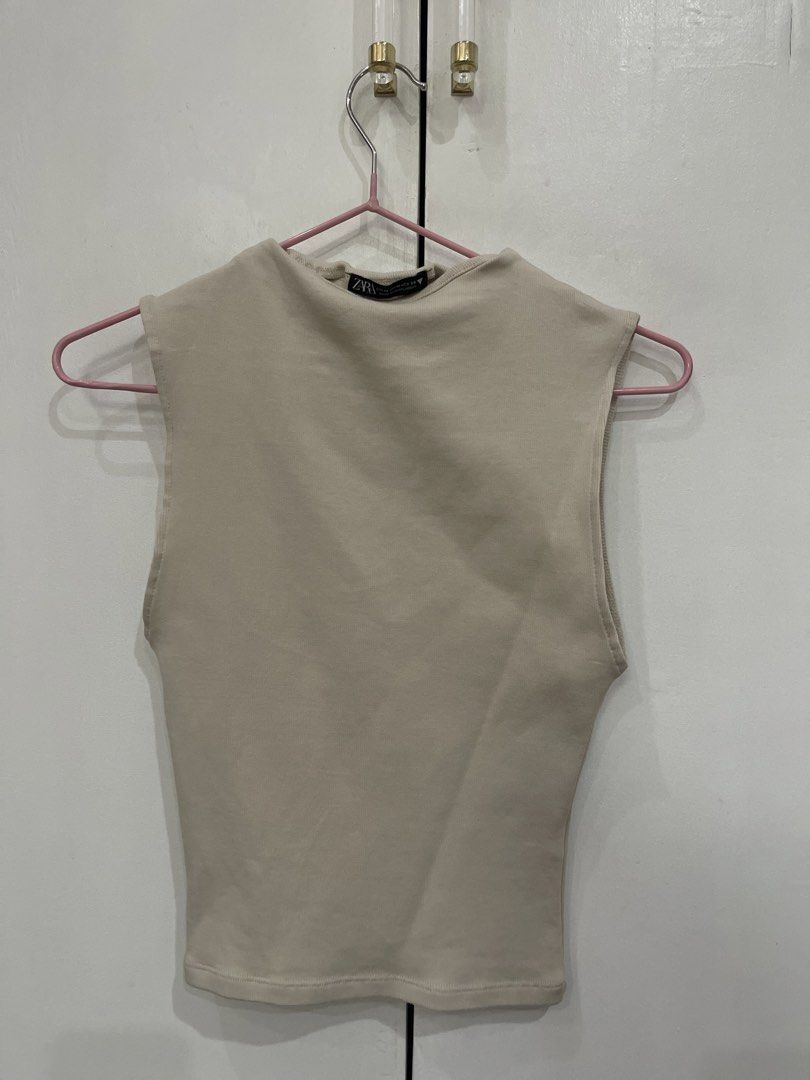 Zara Beige Sleeveless Mock Neck Top (Category: Sleeveless) located in Quezon City. Submitted by kiwis_closet (Listing ID 1440245934, Image 1). Description: - Zara beige sleeveless top - Medium.