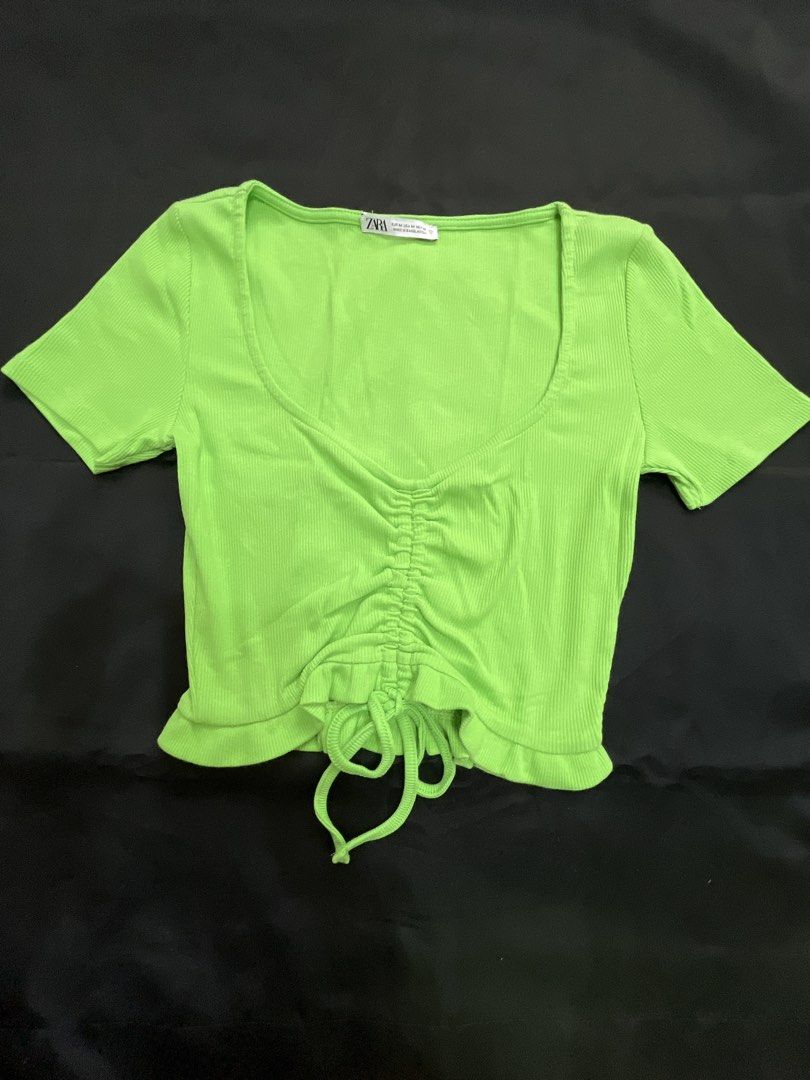 Zara Ribbed Ruched Drawstring Crop Top Lime Green (Category: Sleeveless) located in Pasig City. Submitted by ___she___ (Listing ID 1440242254, Image 1). Description: - Bright lime green ribbed crop top from Zara - Flattering scoop neckline - Short sleeves - Adjustable ruched drawstring detail at the front - Perfect for a casual and stylish look.