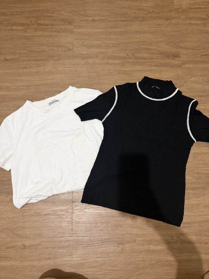 Zara Tops Bundle - Black & White (Category: Blouses) located in Mandaluyong City. Submitted by gemmiebears (Listing ID 1440280543, Image 1). Description: - Bundle of 2 Zara tops - Size: Small (S) - Includes: Classic white t-shirt - Includes: Black ribbed top with white trim detail on neckline and sleeves - Great for building your wardrobe basics - Excellent value bundle deal.