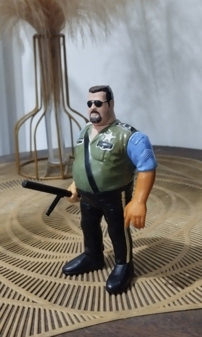 1990 WWF Hasbro Big Boss Man action figure (Category: Action & Battle Toys) located in Manila. Submitted by ventajetoyz625 (Listing ID 1439357325, Image 1). Description: - Vintage action figure - Features a man with sunglasses - Green vest and black pants - Blue shirt - Collectible item - With minimal chipped paint - What you see is what you get.
