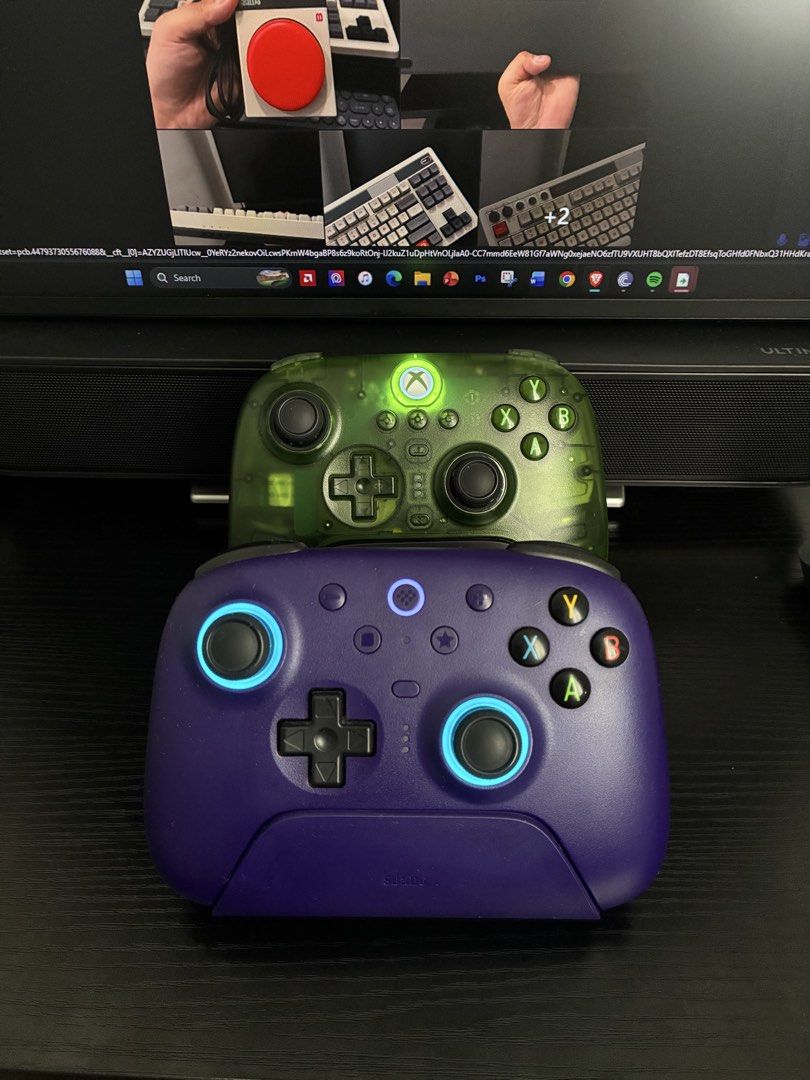 8bitdo Controller (Category: Controllers) located in Manila. Submitted by csmarcelo1 (Listing ID 1440389717, Image 1). Description: FOR SALE! 8BITDO CONTROLLERS ULTIMATE 2 PURPLE WITH DOCK-1500 PESOS ULTIMATE 3 JADE XBOX EDITION-2200 PESOS - Selling a pair of Xbox controllers - Includes one transparent green controller - Includes one deep purple controller - Both controllers have illuminated accents - Both controllers are in great working conditi