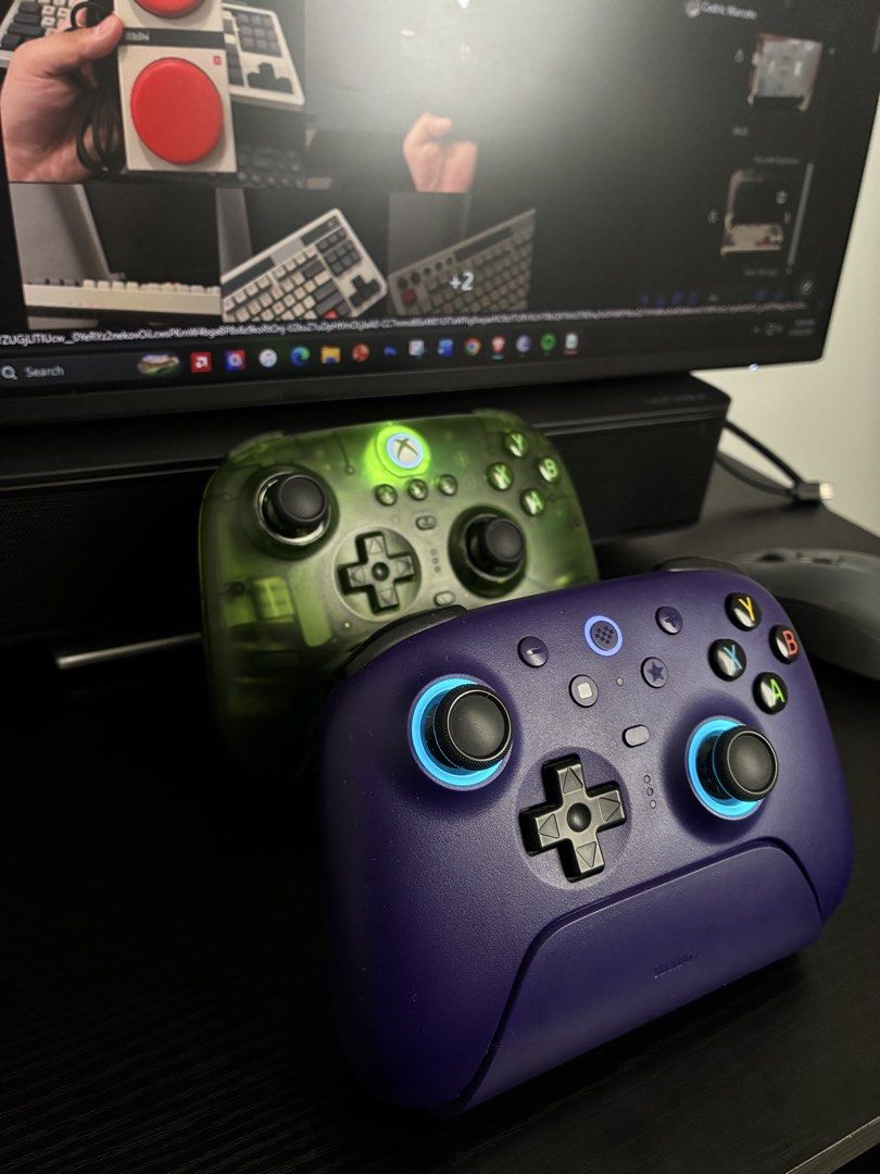 8bitdo Controller (Category: Controllers) located in Manila. Submitted by csmarcelo1 (Listing ID 1440389717, Image 3). Description: FOR SALE! 8BITDO CONTROLLERS ULTIMATE 2 PURPLE WITH DOCK-1500 PESOS ULTIMATE 3 JADE XBOX EDITION-2200 PESOS - Selling a pair of Xbox controllers - Includes one transparent green controller - Includes one deep purple controller - Both controllers have illuminated accents - Both controllers are in great working conditi