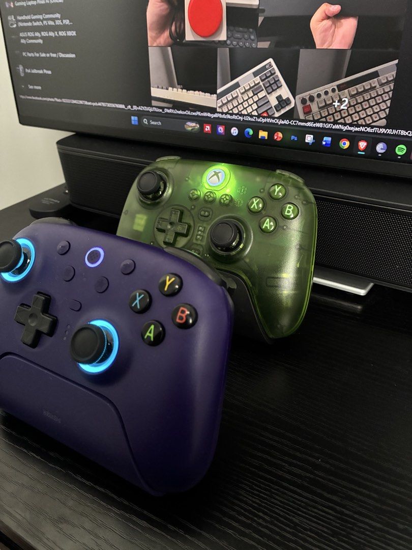 8bitdo Controller (Category: Controllers) located in Manila. Submitted by csmarcelo1 (Listing ID 1440389717, Image 2). Description: FOR SALE! 8BITDO CONTROLLERS ULTIMATE 2 PURPLE WITH DOCK-1500 PESOS ULTIMATE 3 JADE XBOX EDITION-2200 PESOS - Selling a pair of Xbox controllers - Includes one transparent green controller - Includes one deep purple controller - Both controllers have illuminated accents - Both controllers are in great working conditi