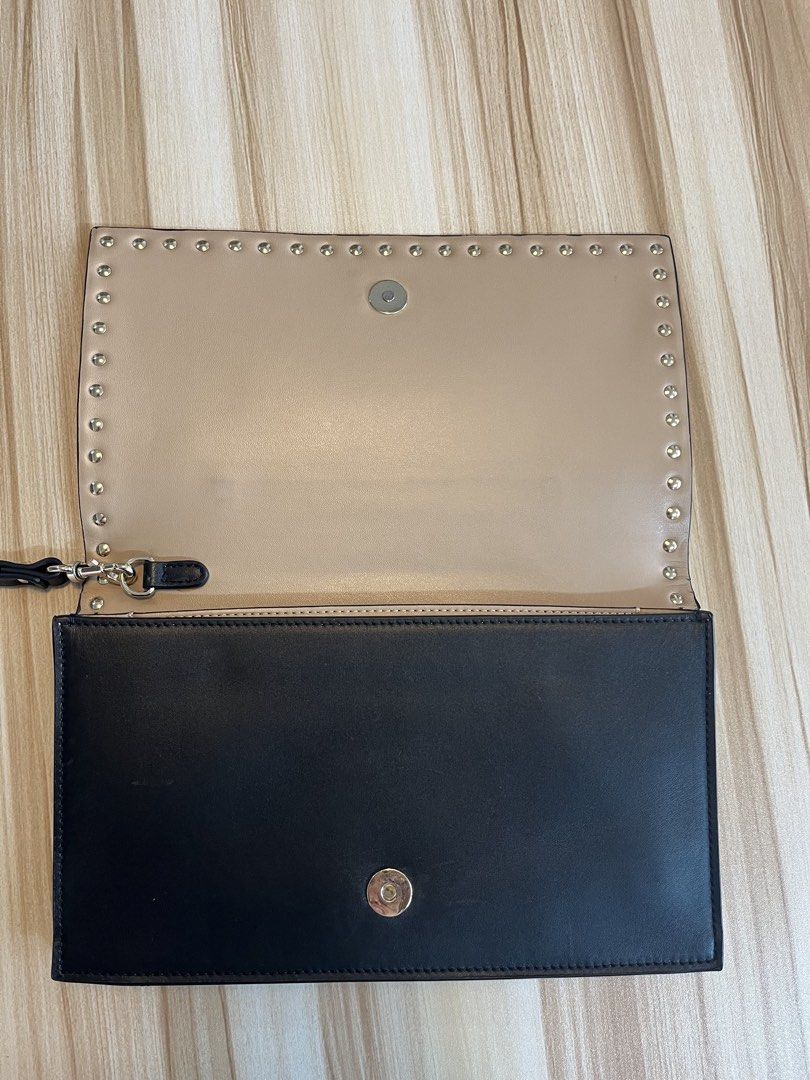 ValentinoGaravani (Category: Luxury Bags & Wallets) located in Manila. Submitted by Lenlen23 (Listing ID 1439829079, Image 3). Description: - Authentic Saint Laurent Sac De Jour Nano bag - Color: Navy blue - Includes: Detachable shoulder strap, dust bag, and authenticity cards - Hardware: Gold-toned - Closure: Zip - Design: Classic, versatile style - Features top handle - Lined interior.