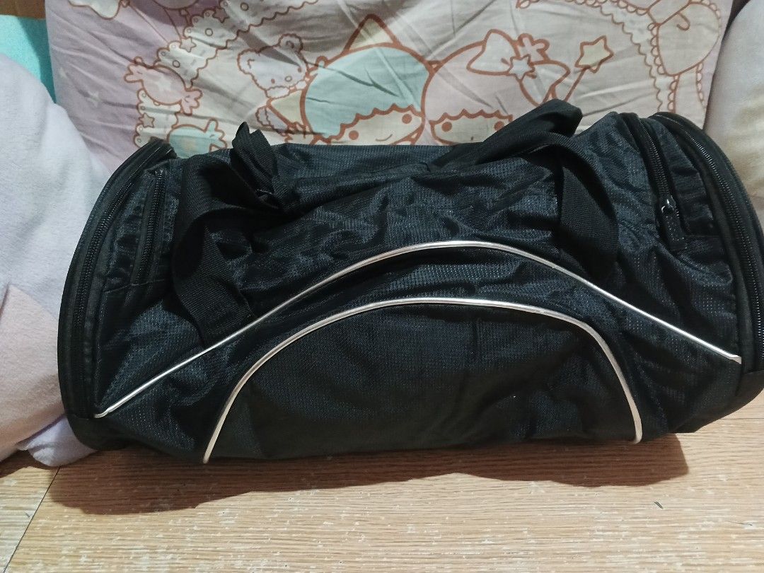 Adidas Black Duffel Bag (Category: Backpacks) located in Rizal. Submitted by a.s.r (Listing ID 1440527966, Image 2). Description: - Classic black Adidas duffel bag - Secure zipper closure - Stylish silver trim accents on the front - Ideal for gym sessions or weekend getaways - Spacious interior for all your essentials.