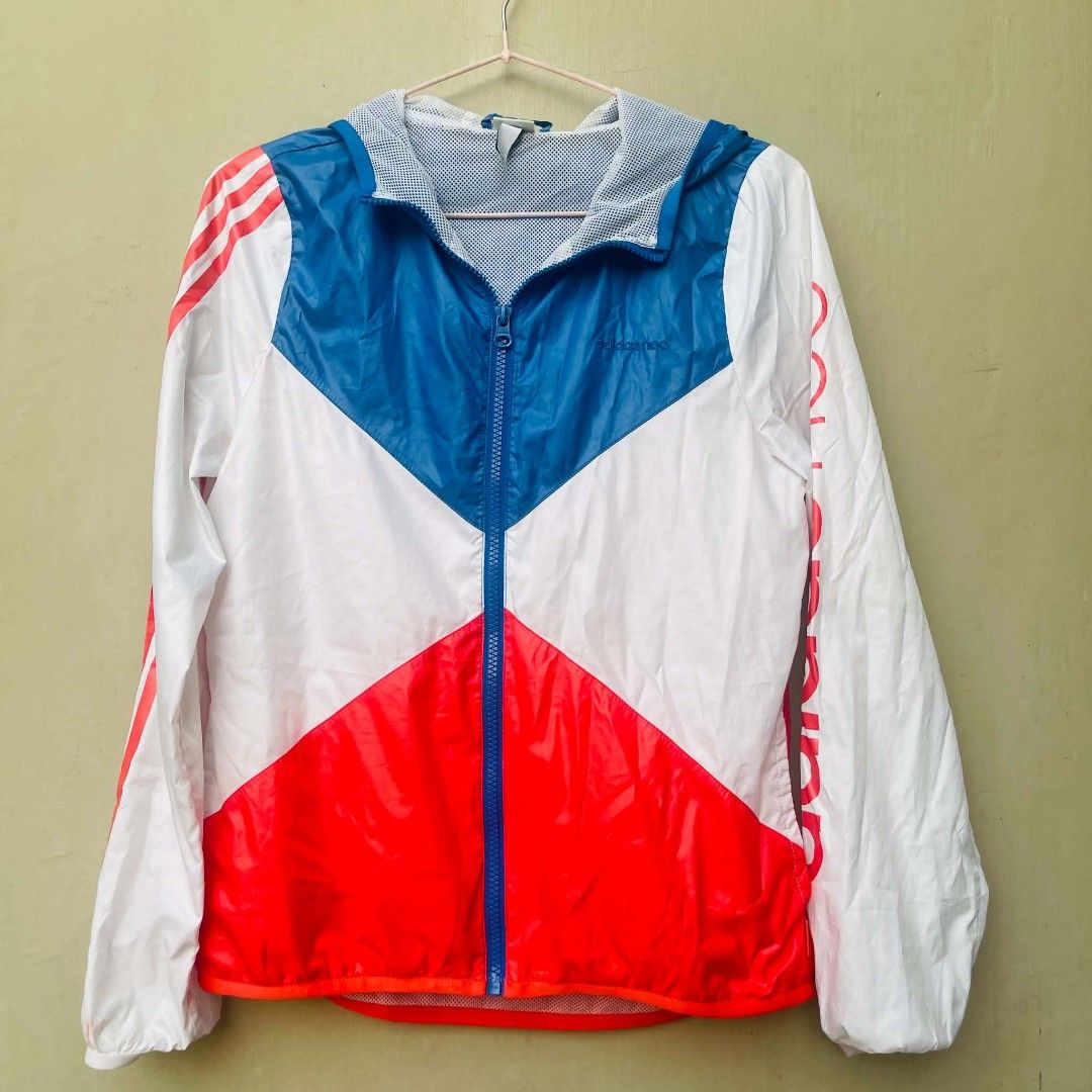 Adidas Neo Windbreaker Jacket Size M (Category: Coats, Jackets and Outerwear) located in Bulacan. Submitted by fenph2021 (Listing ID 1440500790, Image 1). Description: - Adidas Neo color block windbreaker - Size: Medium (M) - Colors: White, blue, and red - Features Adidas branding on the sleeve - Inner mesh lining for comfort - Ideal for light outdoor activities and casual styling.