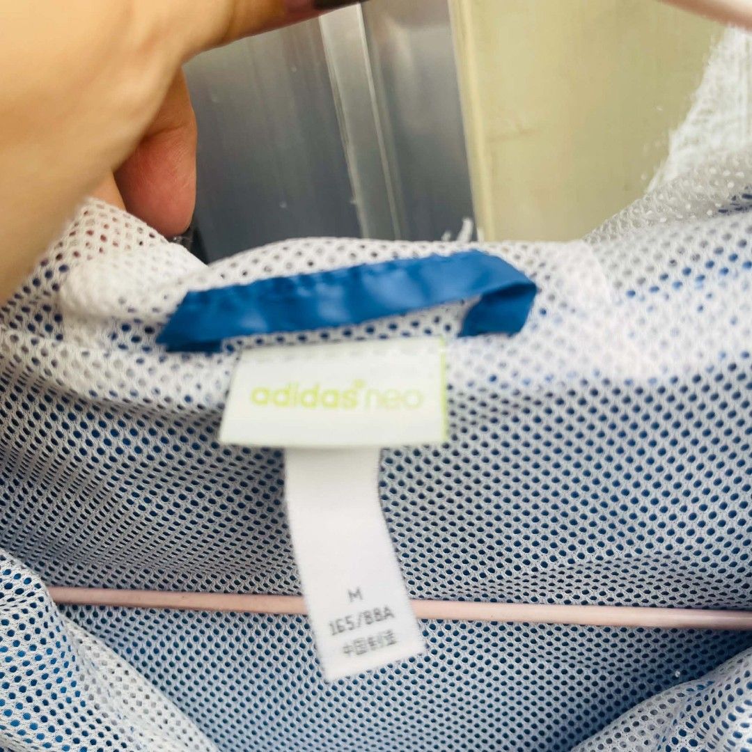 Adidas Neo Windbreaker Jacket Size M (Category: Coats, Jackets and Outerwear) located in Bulacan. Submitted by fenph2021 (Listing ID 1440500790, Image 3). Description: - Adidas Neo color block windbreaker - Size: Medium (M) - Colors: White, blue, and red - Features Adidas branding on the sleeve - Inner mesh lining for comfort - Ideal for light outdoor activities and casual styling.