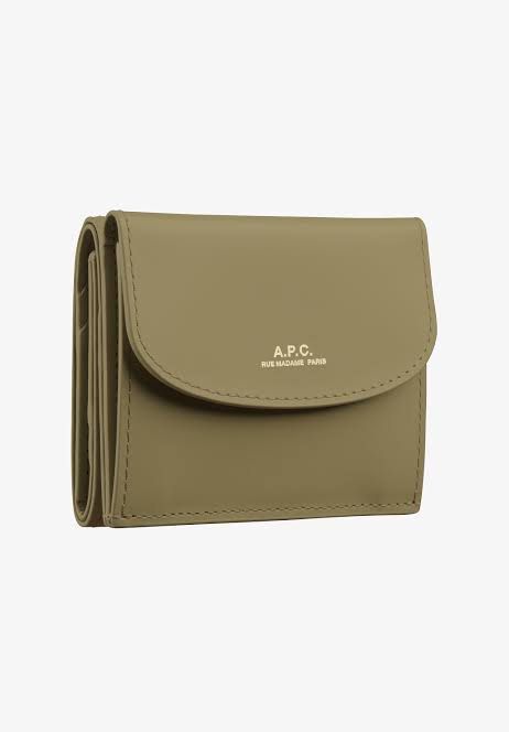 A.P.C. Geneve Trifold Wallet in Olive (Category: Wallets & Card holders) located in Taguig. Submitted by blessthismessph (Listing ID 1440497638, Image 1). Description: - Olive green trifold wallet - Brand: A.P.C. - Made in France - Embossed A.P.C. logo on front flap - Compact size, perfect for essentials - Material: Leather - Clean and simple design Actual photos available upon request, dust pouch included. Retails 14K, slightly negotiable but no