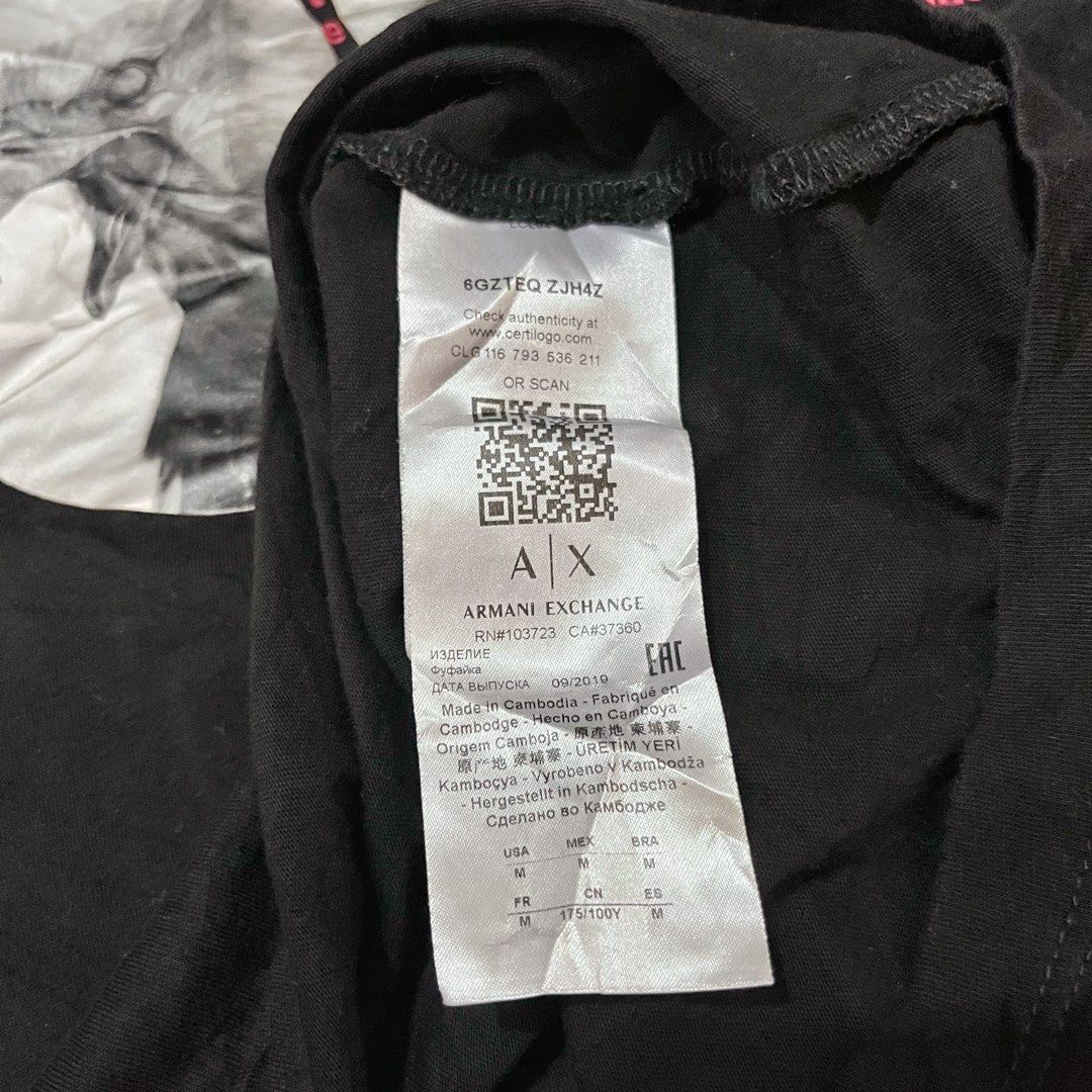 Armani Exchange Black Eagle Graphic T-Shirt Size M (Category: Tshirts & Polo Shirts ) located in Cabadbaran. Submitted by reylandx (Listing ID 1440477688, Image 3). Description: - Dimes: 21x28 - Color rate: 9.8/10 - No issue - Armani Exchange T-Shirt - Size: Medium (M) - Design: Cool graphic print with eagle and text - Origin: Made in Cambodia - Style: Ideal for casual wear - Condition: Please check photos for detailed condition.