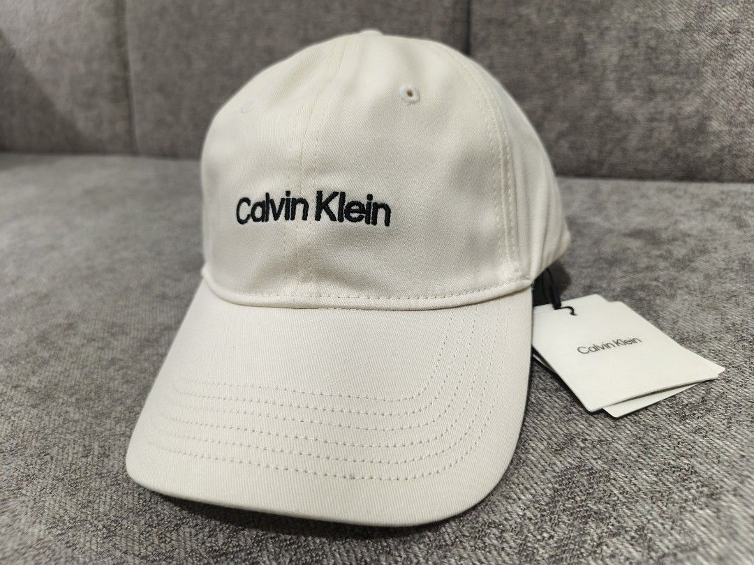 Authentic Calvin Klein Off White Cap (Category: Caps & Hats) located in Paranaque City. Submitted by msperrine (Listing ID 1440487201, Image 2). Description: Authentic Calvin Klein Off White Cap — On Hand & Ready to Ship ✔ Imported from the US ✔ Brand New ✔ Actual photos posted — all photos are taken by us ✔ Last price posted — no haggling please, already below SRP 📍 Parañaque Location • Self pick-up available • Lalamove delivery okay • J&T nati