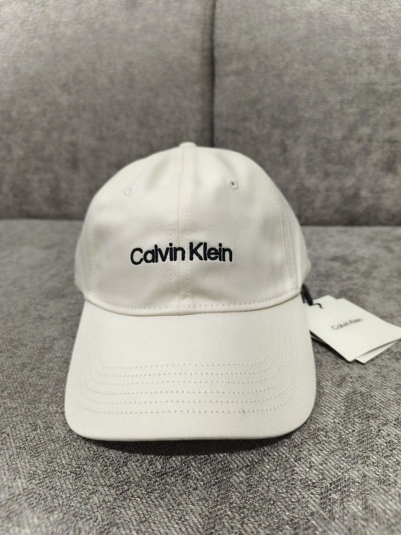 Authentic Calvin Klein Off White Cap (Category: Caps & Hats) located in Paranaque City. Submitted by msperrine (Listing ID 1440487201, Image 1). Description: Authentic Calvin Klein Off White Cap — On Hand & Ready to Ship ✔ Imported from the US ✔ Brand New ✔ Actual photos posted — all photos are taken by us ✔ Last price posted — no haggling please, already below SRP 📍 Parañaque Location • Self pick-up available • Lalamove delivery okay • J&T nati