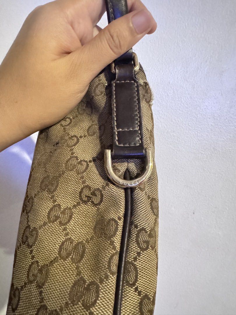 Authentic Gucci Monogram Shoulder Bag with Floral Embroidery (Category: Luxury Bags & Wallets) located in Manila. Submitted by thriftyhaven2023 (Listing ID 1440529213, Image 3). Description: Has flaws on canvas as seen on pictures. And in leather part handle. Hence the bag is still functional and selling low. Pwede maging project bag. GUARANTEED AUTHENTIC. - Authentic Gucci shoulder bag - Classic GG monogram canvas - Beautiful red floral embroide