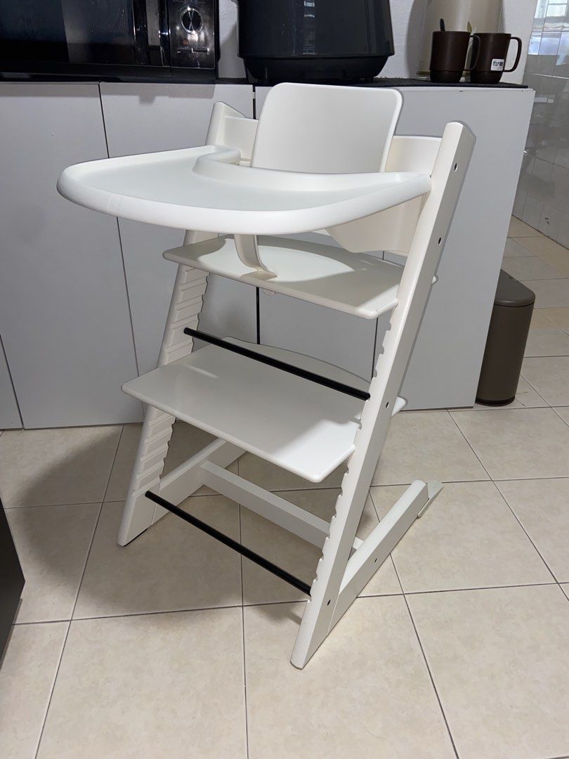 Authentic Stokke Tripp Trapp High Chair White with accessories (Category: Baby High Chairs) located in Singapore. Submitted by rainbowafterrain_sg (Listing ID 1440399365, Image 3). Description: Excellent conditions Cleaned and sanitised . Comes with baby set , extended gliders and tray . Fixed price Self pick up from TPY.