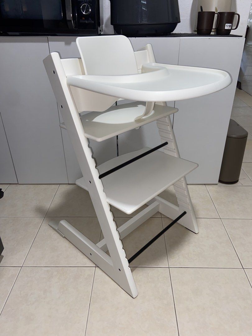 Authentic Stokke Tripp Trapp High Chair White with accessories (Category: Baby High Chairs) located in Singapore. Submitted by rainbowafterrain_sg (Listing ID 1440399365, Image 2). Description: Excellent conditions Cleaned and sanitised . Comes with baby set , extended gliders and tray . Fixed price Self pick up from TPY.