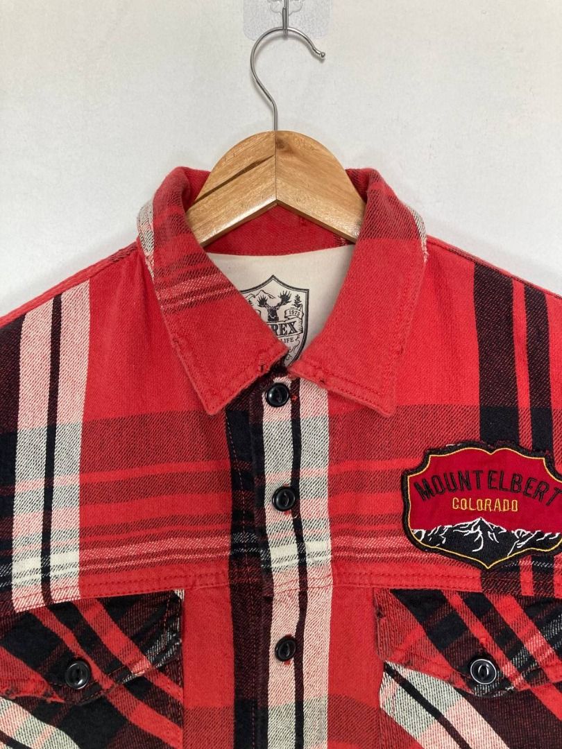 Avirex Embroidered Plaid Flannel (Category: Coats, Jackets and Outerwear) located in Quezon City. Submitted by stylenpick (Listing ID 1440541460, Image 3). Description: Brand: Avirex Made in: USA Year: Material: Cotton Color: Red plaid Marked size: L Sizing: Slim M-L Measurements (laid flat) Shoulders: 17.5" Sleeves: 23.5” Width: 21” Hem: 21" Length: 26” Color rating: 8.5/10 Condition: 8.5/10 Flaws: signs of usage, light fraying .