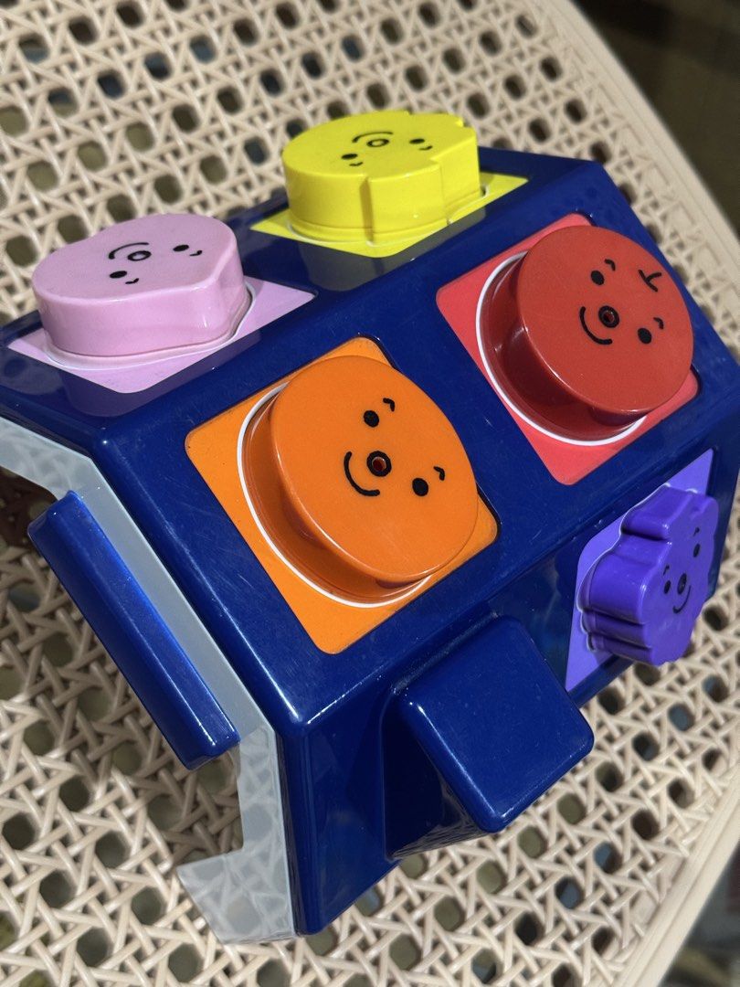 Benesse Fruit/shape sorter (Category: Infant Playtime) located in Pasig City. Submitted by rodzrox (Listing ID 1440528230, Image 1). Description: - Benesse shape/fruit sorter - Features bright buttons with cute fruit faces - Encourages fine motor skills and hand-eye coordination - Teaches cause and effect - Shows minor scuffs from normal play.