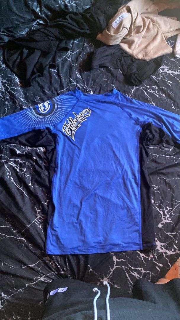 Billabong Blue Long Sleeve Rash Guard (Category: Rash guard) located in San Pedro. Submitted by raprap.monte (Listing ID 1440402438, Image 1). Description: - Blue Billabong long-sleeve rash guard - Graphic design on left sleeve and chest - Ideal for surfing and swimming - Stretchy and quick-drying material - Provides excellent sun protection.