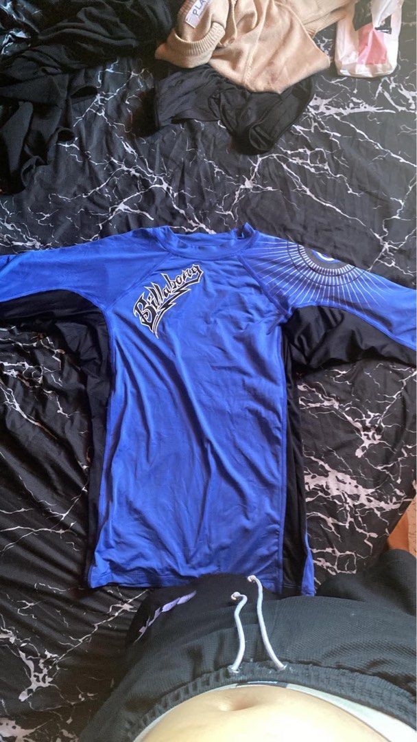 Billabong Blue Long Sleeve Rash Guard (Category: Rash guard) located in San Pedro. Submitted by raprap.monte (Listing ID 1440402438, Image 2). Description: - Blue Billabong long-sleeve rash guard - Graphic design on left sleeve and chest - Ideal for surfing and swimming - Stretchy and quick-drying material - Provides excellent sun protection.