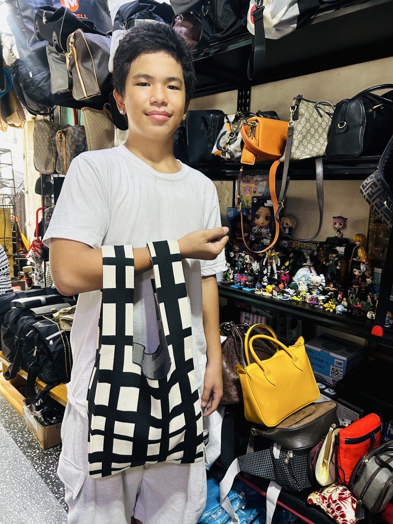 Black and White Checkered Knit Tote Bag (Category: Announcements) located in Manila. Submitted by starbalesukandjapansurplus (Listing ID 1440434976, Image 3). Description: - Stylish checkered knit tote bag in black and white. - Versatile wear: use as a shoulder bag or tie it up for a smaller handbag. - Ideal for groceries, shopping, or everyday essentials. - Crafted from soft, comfortable knit material. - Features a unique and eye-catching design
