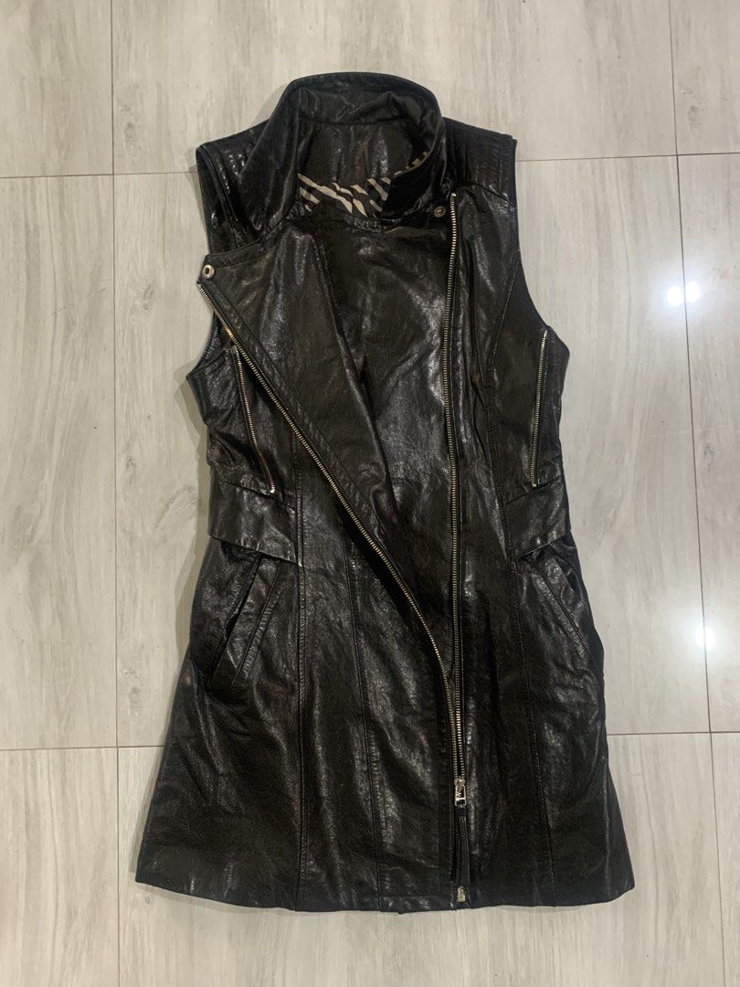 Black Faux Leather Vest (Category: Coats, Jackets and Outerwear) located in Cebu City. Submitted by scematary (Listing ID 1440561460, Image 2). Description: Length- 31 Width- 15.5 Hem - 20 - Cool black vest - Unique zebra print lining - Asymmetrical zip front - Stand-up collar - Corset-style lace-up back for adjustable fit - Great for layering over tops or dresses - Statement piece for an edgy look.
