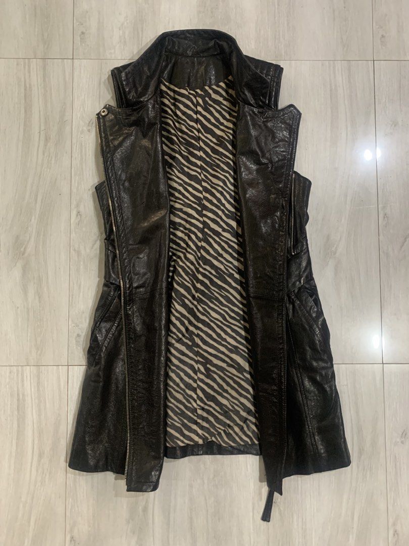 Black Faux Leather Vest (Category: Coats, Jackets and Outerwear) located in Cebu City. Submitted by scematary (Listing ID 1440561460, Image 3). Description: Length- 31 Width- 15.5 Hem - 20 - Cool black vest - Unique zebra print lining - Asymmetrical zip front - Stand-up collar - Corset-style lace-up back for adjustable fit - Great for layering over tops or dresses - Statement piece for an edgy look.