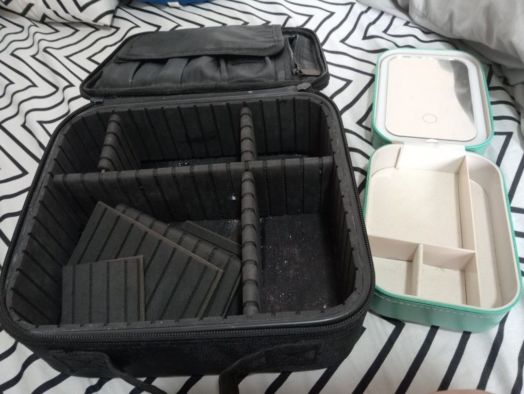 Black Makeup bag and jewelry Box (Category: Accessory Holder, Box & Organizers) located in Quezon City. Submitted by lourlll (Listing ID 1440474779, Image 2). Description: - Black makeup train case with adjustable dividers - Separate teal jewelry box included - Jewelry box features a mirror with rechargable light and compartments - case has a handle for easy carrying - Ideal for organizing makeup and accessories - Perfect for travel or home use .