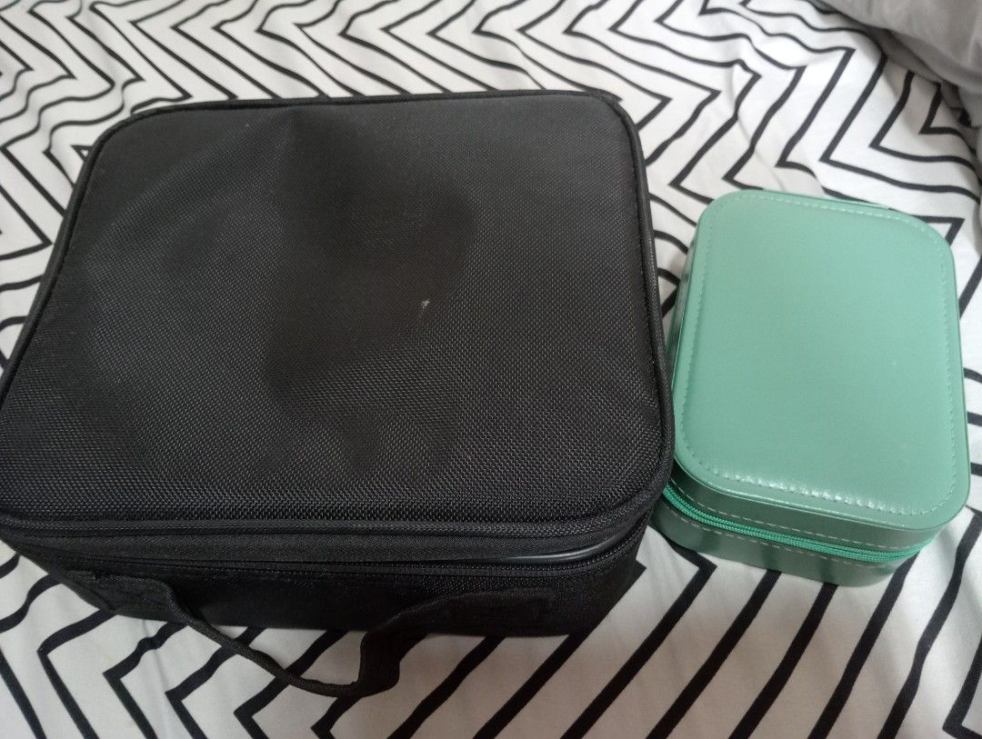 Black Makeup bag and jewelry Box (Category: Accessory Holder, Box & Organizers) located in Quezon City. Submitted by lourlll (Listing ID 1440474779, Image 1). Description: - Black makeup train case with adjustable dividers - Separate teal jewelry box included - Jewelry box features a mirror with rechargable light and compartments - case has a handle for easy carrying - Ideal for organizing makeup and accessories - Perfect for travel or home use .