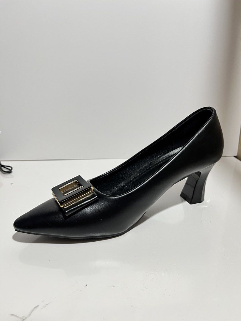 Black Pointed Toe Heels with Gold Buckle - Size 39 (Category: Heels) located in Marikina City. Submitted by youngstorm_04b594 (Listing ID 1440422899, Image 1). Description: I only used it once during my graduation. Bought this for ₱577, I can provide a proof just message me. - Classic black pointed toe heels - Chic gold buckle with subtle sparkle - Comfortable mid-height flared heel - Cushioned insole for added comfort - Size 39 - Versatile for w