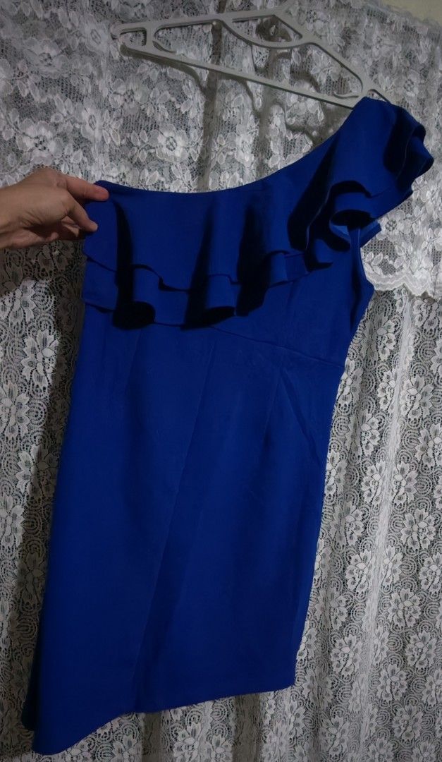 Blue One Shoulder Ruffle Dress (Category: Dresses) located in Cavite. Submitted by MLstore (Listing ID 1440516555, Image 2). Description: - Royal blue one-shoulder dress - Layered ruffle detail on bust and shoulder - Fitted silhouette - Side zipper closure - Ideal for parties and events - Chic and sophisticated look Fits M-L size.
