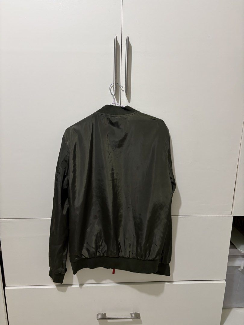 Bobson Olive Green Bomber Jacket Size M (Category: Coats, Jackets and Outerwear) located in Pasig City. Submitted by grumpycat15 (Listing ID 1440493376, Image 3). Description: - Bobson Olive Green Bomber Jacket - Made in Japan - Size: Medium (M) - Classic bomber style with ribbed cuffs and hem - Lightweight material, ideal for layering - Perfect for casual wear - Please check photos for detailed condition.