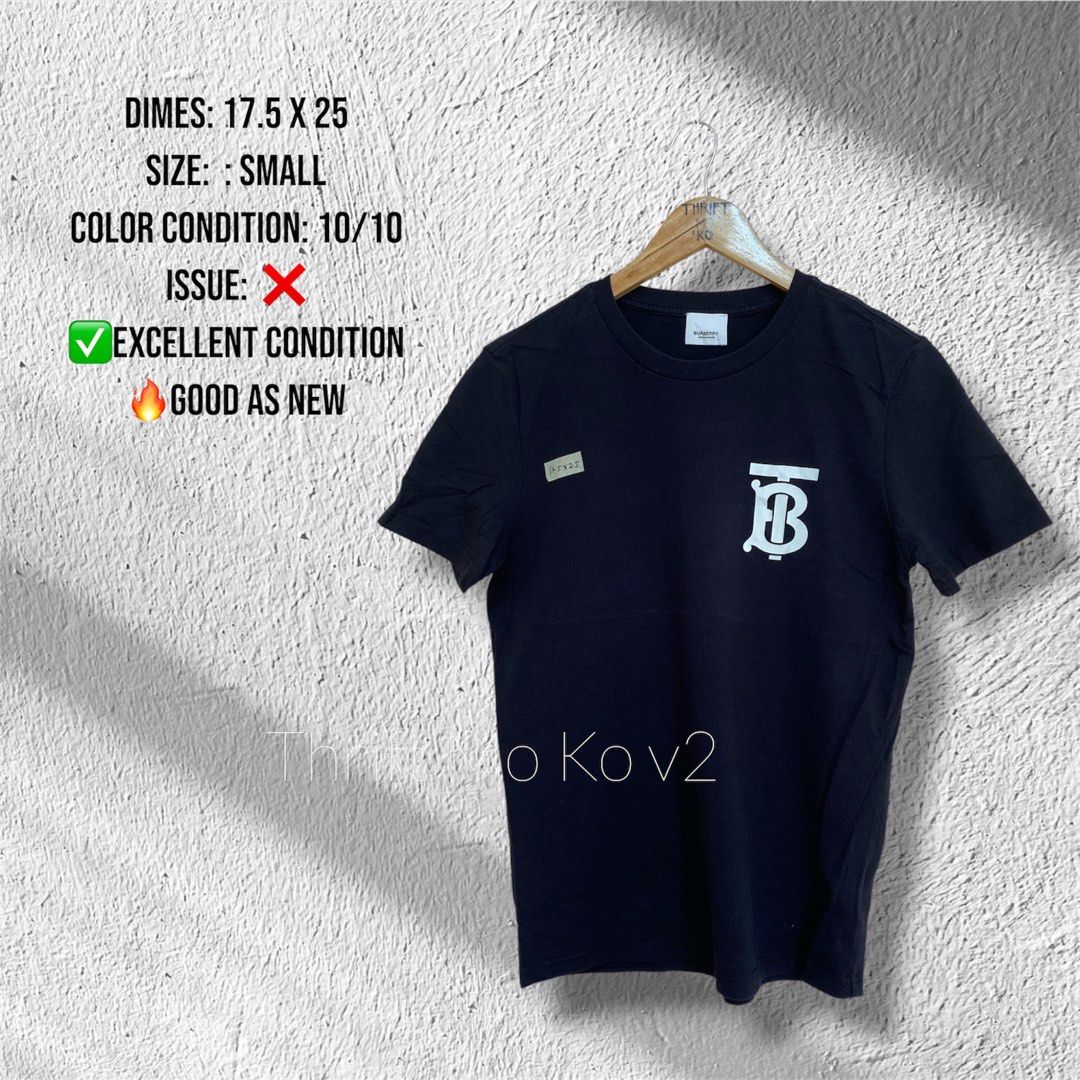 Burberry Black Monogram Logo T-Shirt (Category: Tshirts & Polo Shirts ) located in Santiago. Submitted by mfdthriftstore (Listing ID 1440458457, Image 1). Description: - Authentic Burberry Black T-shirt - Iconic TB monogram logo on chest - Size: Small - Made in Portugal - Material: 98% Cotton, 2% Elastane - Condition: Excellent, good as new, no issues.