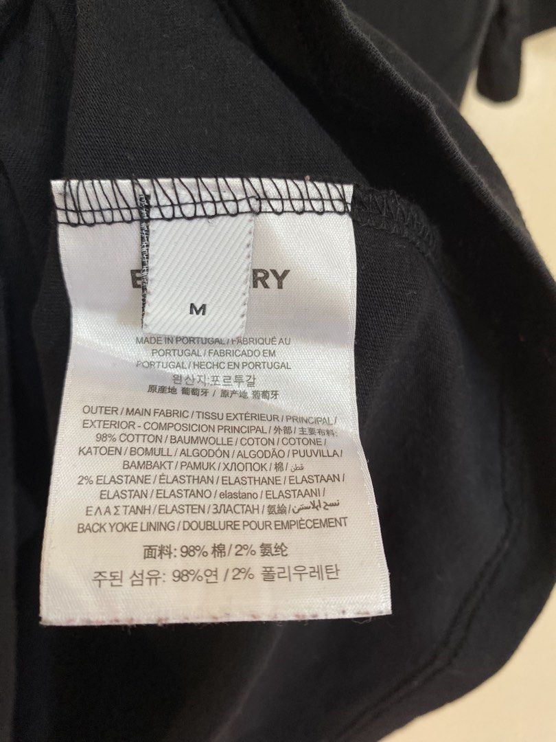Burberry Black Monogram Logo T-Shirt (Category: Tshirts & Polo Shirts ) located in Santiago. Submitted by mfdthriftstore (Listing ID 1440458457, Image 3). Description: - Authentic Burberry Black T-shirt - Iconic TB monogram logo on chest - Size: Small - Made in Portugal - Material: 98% Cotton, 2% Elastane - Condition: Excellent, good as new, no issues.