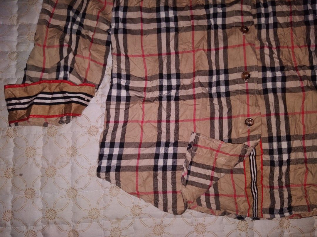 Burberry Nova Check Button down longsleeve women (Category: Coats, Jackets and Outerwear) located in Zamboanga. Submitted by zhumhazhav (Listing ID 1440577045, Image 3). Description: - Classic Burberry longsleeve Polo Shirt - Iconic Burberry checkered pattern throughout - Button down style with collared neckline - Buttoned cuffs - Features check pattern on pockets & cuffs - Excellent condition to as new - Size38 on tag - Dimensions Width 18 Lengt
