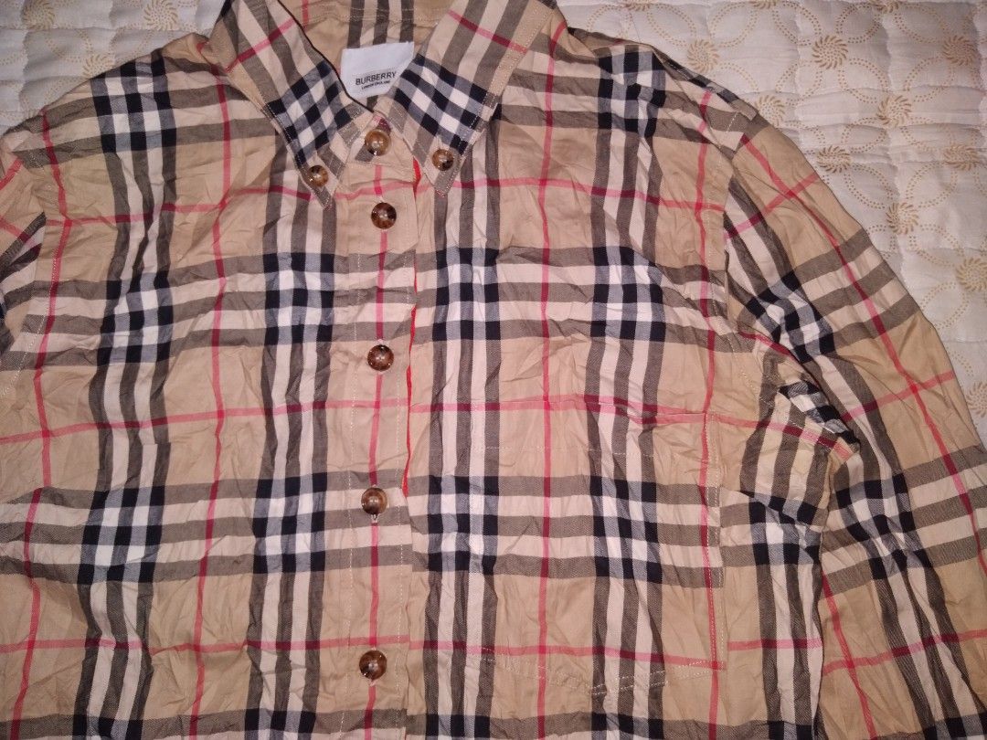 Burberry Nova Check Button down longsleeve women (Category: Coats, Jackets and Outerwear) located in Zamboanga. Submitted by zhumhazhav (Listing ID 1440577045, Image 2). Description: - Classic Burberry longsleeve Polo Shirt - Iconic Burberry checkered pattern throughout - Button down style with collared neckline - Buttoned cuffs - Features check pattern on pockets & cuffs - Excellent condition to as new - Size38 on tag - Dimensions Width 18 Lengt
