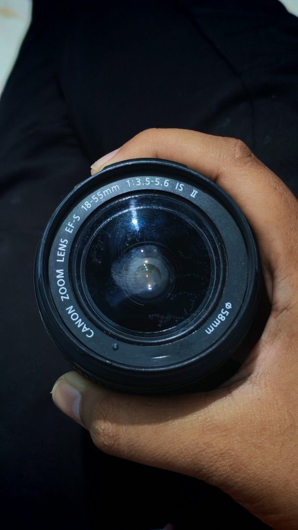 Canon 18-55mm IS II Lens (Issue: Fungus) (Category: Lens & Kits) located in Akbar. Submitted by anyastough (Listing ID 1440484571, Image 3). Description: Unit: Canon EF-S 18-55mm f/3.5-5.6 IS II ​Issue: Front element has prominent internal fungal growth/haze. Needs professional cleaning to restore optimal clarity. ​Status: Autofocus and image stabilization switches are completely functional. Smooth zoom ring. ​Selling cheap, strictly as-is for pa