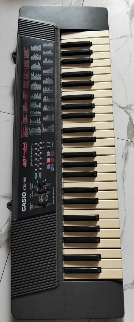 Vintage Casio CTK-200 49-Key Portable Keyboard (Category: Musical Instruments) located in Quezon City. Submitted by heybailey (Listing ID 1440401765, Image 1). Description: - Casio CTK-200 Keyboard - 49 Keys - Variety of Tones and Rhythms - Power/Mode Slider & Volume Sliders - Pulse Code Modulation (PCM) Technology - Ideal for Learning or Casual Playing - In good working condition.