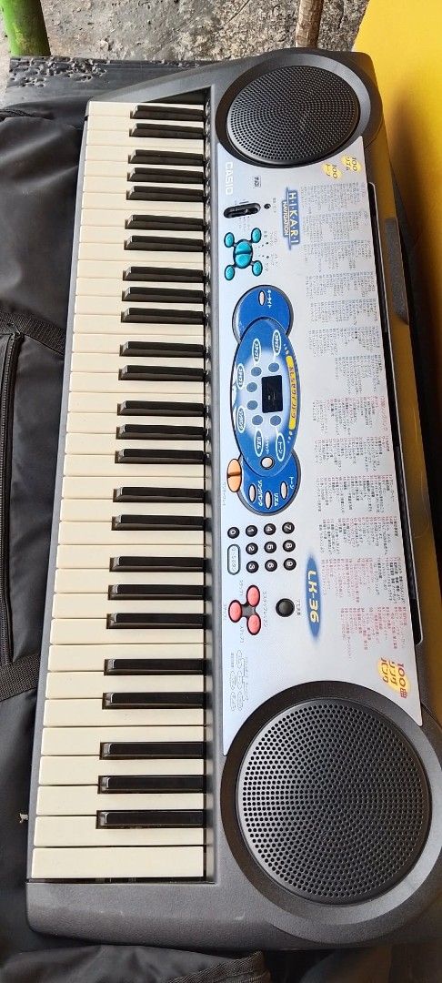 Casio Keyboard with Bag (Category: Musical Instruments) located in Quezon City. Submitted by jpnvintageonline (Listing ID 1440458252, Image 2). Description: - Casio keyboard with multiple sound and function keys. - Built-in speakers on both sides. - Includes a black carrying bag with handles for easy transport. -Japanese character reference - Ideal for learning to play or for casual enjoyment..