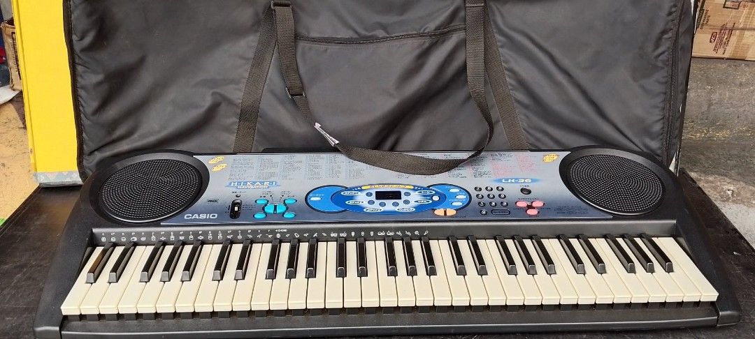 Casio Keyboard with Bag (Category: Musical Instruments) located in Quezon City. Submitted by jpnvintageonline (Listing ID 1440458252, Image 1). Description: - Casio keyboard with multiple sound and function keys. - Built-in speakers on both sides. - Includes a black carrying bag with handles for easy transport. -Japanese character reference - Ideal for learning to play or for casual enjoyment..