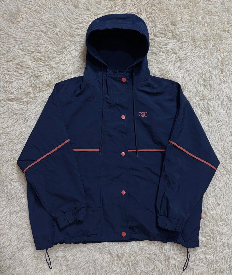 Celine Navy Blue Hooded Windbreaker Jacket (Category: Coats, Jackets and Outerwear) located in Baguio. Submitted by 8luck (Listing ID 1440492146, Image 1). Description: Celine size Large fitting notworking snap buttong but working zip.