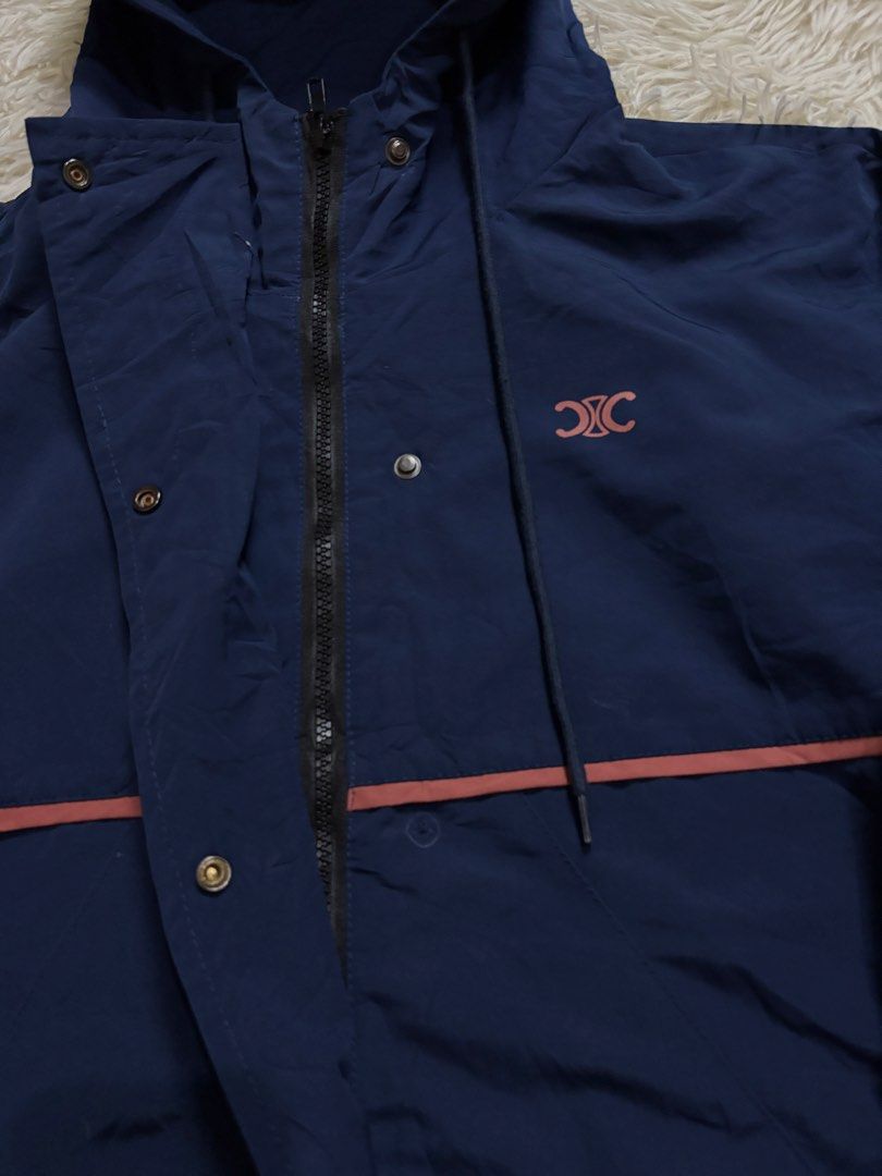 Celine Navy Blue Hooded Windbreaker Jacket (Category: Coats, Jackets and Outerwear) located in Baguio. Submitted by 8luck (Listing ID 1440492146, Image 3). Description: Celine size Large fitting notworking snap buttong but working zip.