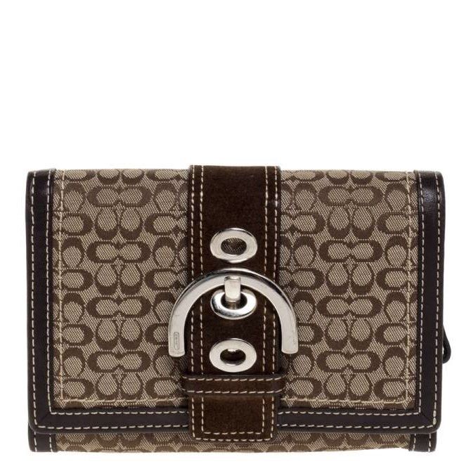 coach brown signature buckle flap compact wallet (Category: Wallets & Card holders) located in Rizal. Submitted by z00vi (Listing ID 1440475133, Image 1). Description: - authentic! bought in spain :) - used but not abused (dm me for actual pics), pls manage ur expectations - genuine leather! hindi nagbabakbak or crack - many card slots inside.